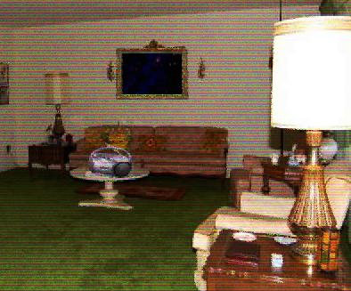 ugly living room with a cd player, an empty frame and an old couch